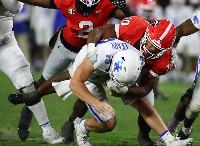 Georgia inside linebacker Jamon Dumas-Johnson sacks Kentucky quarterback Devin Leary for a loss during the third quarter in a NCAA college football game on Saturday, Oct. 7, 2023, in Athens.  Curtis Compton for the Atlanta Journal Constitution