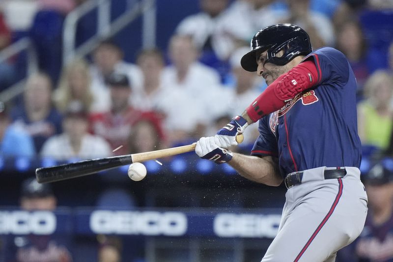 Atlanta Braves' Ramón Laureano splinters his bat during the first inning of a baseball game against the Miami Marlins, Sunday, Sept. 22, 2024, in Miami. (AP Photo/Wilfredo Lee)