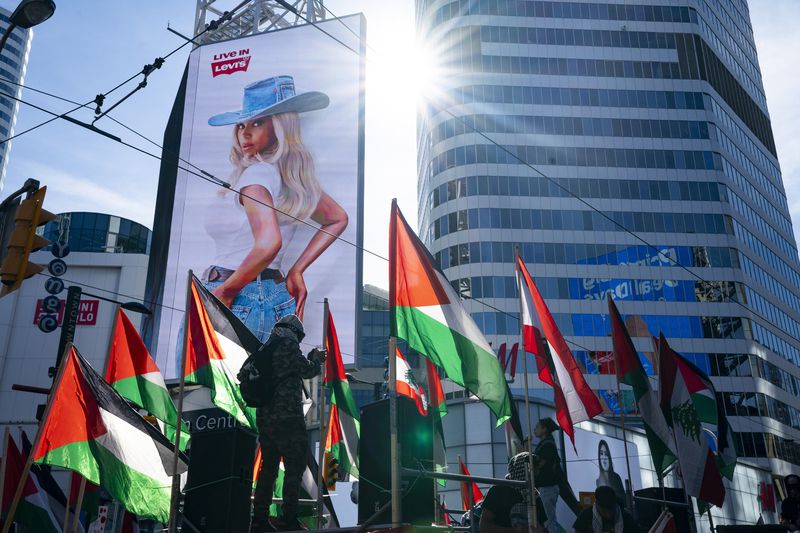 Demonstrators protest in support of the Palestinian people, Saturday, Oct. 5, 2024, in Toronto, days before the one-year anniversary of Hamas' attack in southern Israel and Israel's response to go to war on Hamas. (Arlyn McAdorey/The Canadian Press via AP)