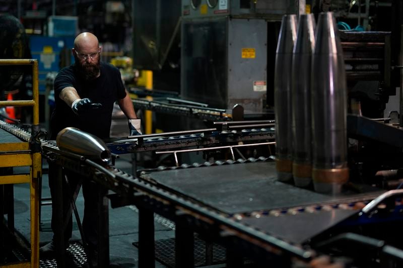 FILE - A steel worker moves a 155 mm M795 artillery projectile at the Scranton Army Ammunition Plant, Tuesday, Aug. 27, 2024, in Scranton, Pa. (AP Photo/Matt Slocum, File)