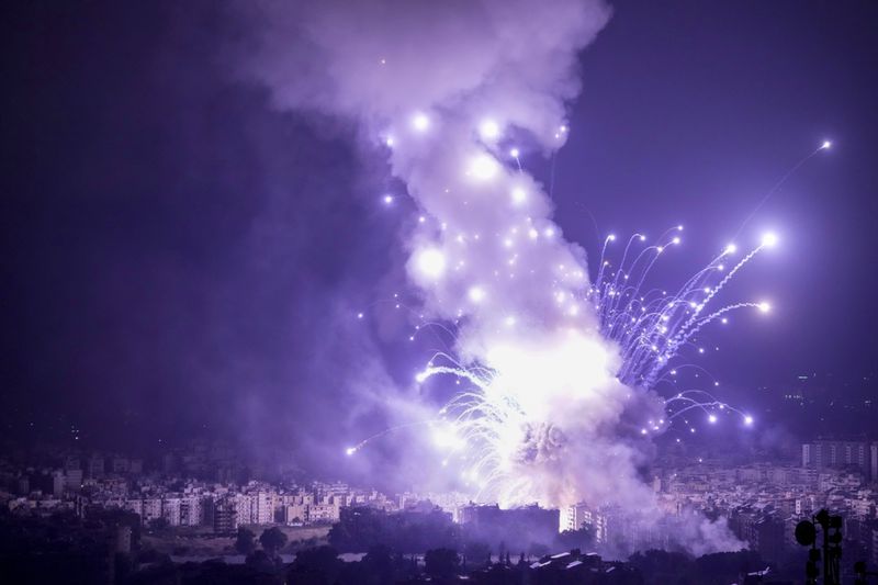 Flames and smoke rise from an Israeli airstrike in Dahiyeh, Beirut, Lebanon, Sunday, Oct. 6, 2024. (AP Photo/Bilal Hussein)