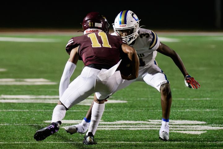 Chamblee's Larry Harris (right) prepares to make a tackle. (Jamie Spaar for the Atlanta Journal Constitution)