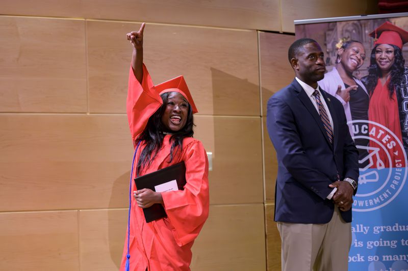 Shedreka Leblanc celebrating receiving a high school equivalency (HiSET) diploma at a graduation ceremony for the Youth Empowerment Project (YEP) in New Orleans, Thursday, June 27, 2024. (AP Photo/Matthew Hinton)