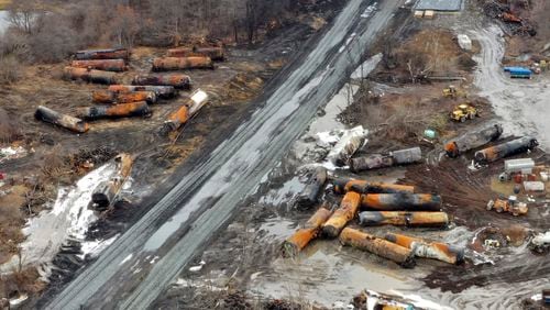 FILE - This image taken with a drone shows the continuing cleanup of portions of a Norfolk Southern freight train on Feb. 9, 2023, that derailed in East Palestine, Ohio. Amit Bose, the head of the Federal Railroad Administration, plans to testify at a House hearing Tuesday, July 23, 2024, that railroad safety has stagnated over the last decade and more needs to be done. But it's not clear if Republicans will support any rail safety reforms even after the disastrous East Palestine derailment that prompted the hearing. (AP Photo/Gene J. Puskar, File)