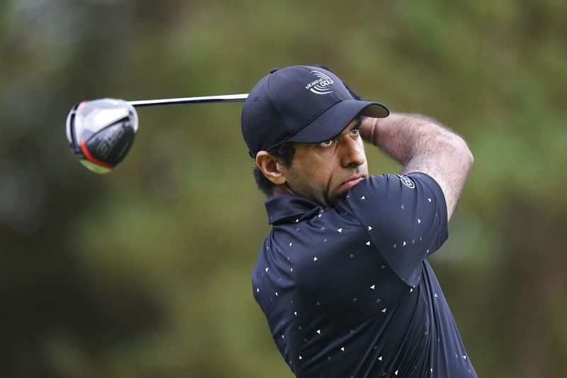 England's Aaron Rai tees off the 8th during day two of the 2024 BMW PGA Championship at Wentworth Golf Club in Virginia Water, England, Friday, Sept. 20, 2024. (Zac Goodwin/PA via AP)