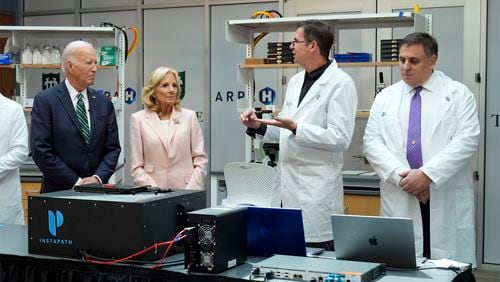 President Joe Biden and first lady Jill Biden listen during a demonstration of cancer research and detection techniques at Tulane University, Tuesday, Aug. 13, 2024, in New Orleans. (AP Photo/Mark Schiefelbein)