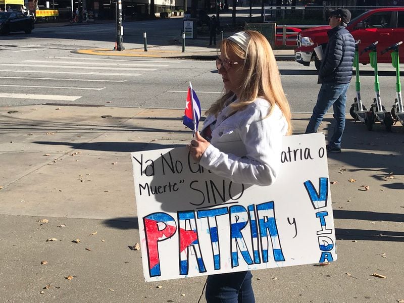 Liset Mullor holds a handmade 'Patria y Vida' sign at a downtown rally on Sunday, November 14, 2021.