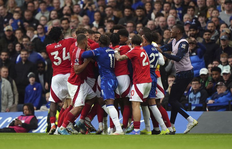 Tempers flare between Nottingham Forest and Chelsea players during the English Premier League soccer match between Chelsea and Nottingham Forest at Stamford Bridge in London, Sunday Oct. 6, 2024. (Bradley Collyer/PA via AP)