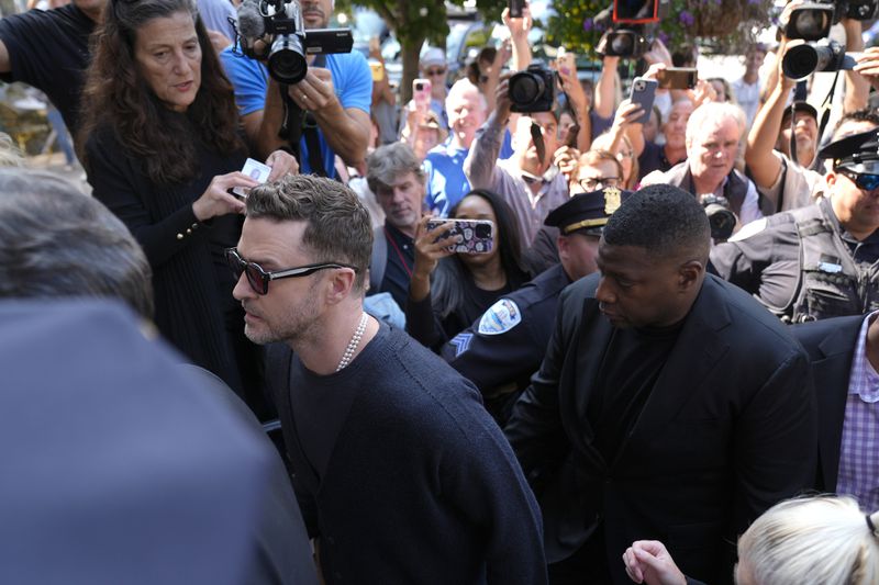 Justin Timberlake, left, walks into court for his arraignment, Friday, Sept. 13, 2024, in Sag Harbor, N.Y. (AP Photo/Pamela Smith)