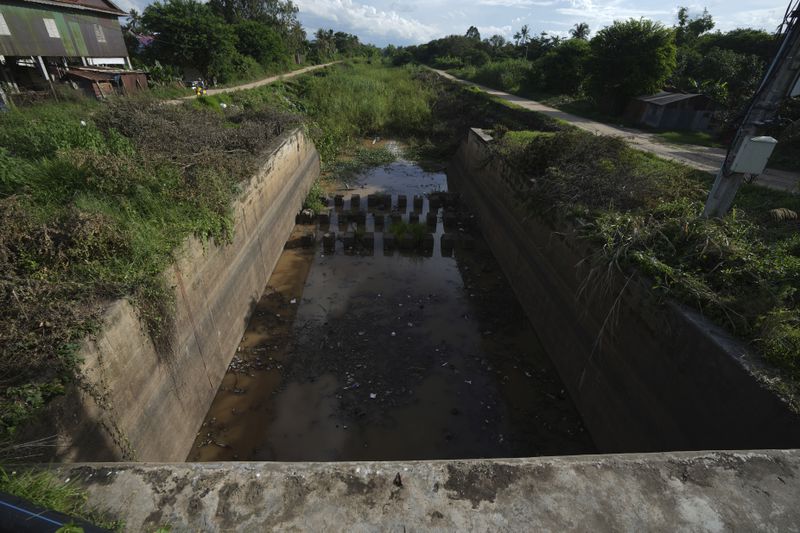 A water gate to the Funan Techo Canal is seen at Prek Takeo village, eastern Phnom Penh, Cambodia, Tuesday, July 30, 2024. (AP Photo/Heng Sinith)