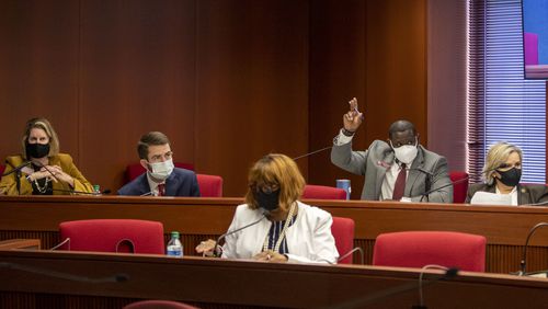 Rep. Demetrius Douglas, a member of the House Special Committee of Elections Integrity, raises his hand to present a question during a meeting Tuesday. The committee amended a bill Tuesday setting deadlines for voters to request absentee ballots and counties to respond to those requests. (Alyssa Pointer / Alyssa.Pointer@ajc.com)