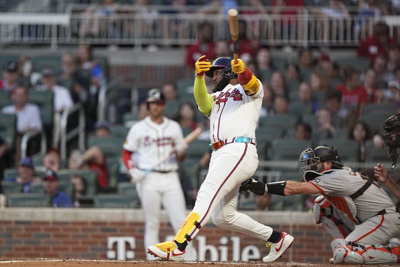 Atlanta Braves designated hitter Marcell Ozuna (20) singles in the fifth inning of a baseball game against the San Francisco Giants, Wednesday, July 3, 2024, in Atlanta. (AP Photo/Brynn Anderson)