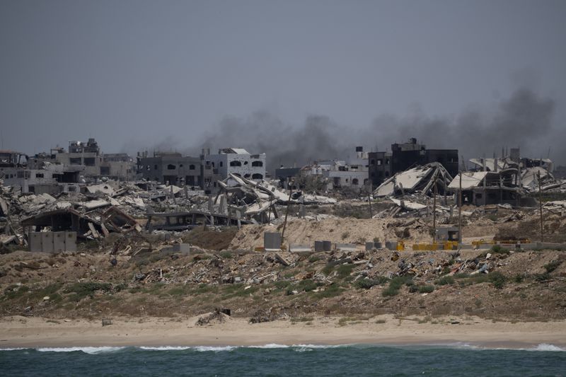 Destroyed buildings stand in the coast of the Gaza Strip as seen from the Mediterranean Sea, Tuesday, June 25, 2024. (AP Photo/Leo Correa)