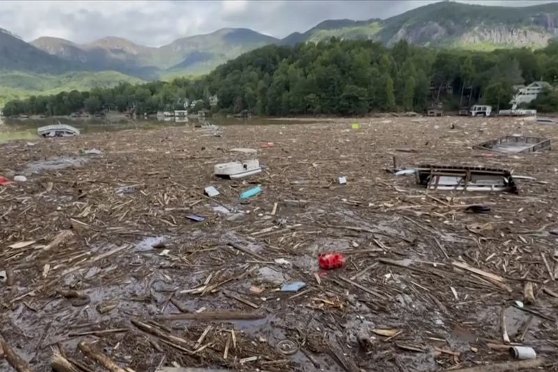 Flood debris from Hurricane Helene floats by in Rutherford County, N.C., Sunday, Sept. 29, 2024. (Tariq Bokhari via AP)