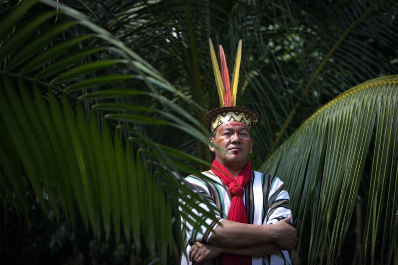 Ashaninka Indigenous leader Francisco Piyako poses for a portrait during the annual celebration recognizing the Ashaninka territory in the Apiwtxa village, Acre state, Brazil, Monday, June 24, 2024. (AP Photo/Jorge Saenz)