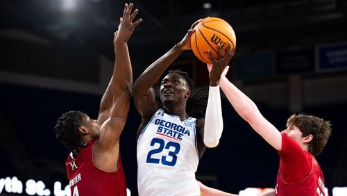 Georgia State's Leslie Nkereuwem powers his way past two defenders to score against Miami (Ohio), Feb. 10, 2024. Nkereuwem scored 14 points on 6-for-8 shooting. (Jett Parker/Georgia State Athletics)