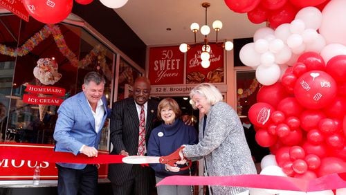 Tim Strickland, Savannah Mayor Van Johnson, Pam Strickland, and Jennifer Strickland cut the ribbon during the grand opening celebration for the newest location of River Street Sweets at 32 E. Broughton Street on Tuesday March 21, 2023.