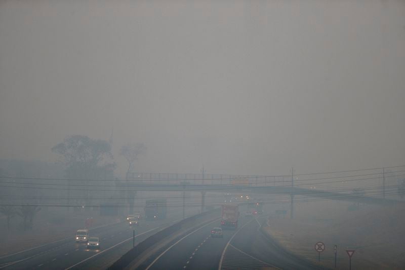 Smoke from wildfires fills the air above the Anhanguera Highway in Ribeirao Preto, Sao Paulo state, Brazil, Sunday, Aug. 25, 2024. (AP Photo/Marcos Limonti)