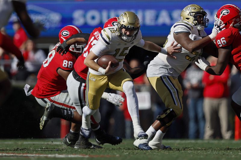 Georgia Tech Yellow Jackets quarterback Zach Gibson (15) runs the ball against the Georgia Bulldogs at Sanford Stadium, Saturday, November 26, 2022, in Athens, Ga. Jason Getz / Jason.Getz@ajc.com)