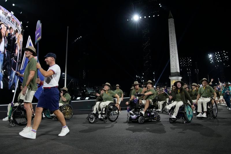 Members of the Australian delegation parade during the Opening Ceremony for the 2024 Paralympics, Wednesday, Aug. 28, 2024, on Concorde plaza in Paris, France. (AP Photo/Christophe Ena)