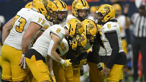 Kennesaw State quarterback Davis Bryson (9) talks during a huddle in the second half of an NCAA college football game against Texas-San Antonio, Saturday, Aug. 31, 2024, in San Antonio. (AP Photo/Darren Abate)