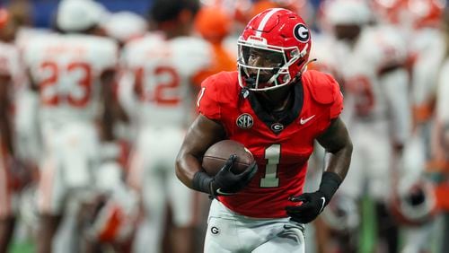 Georgia running back Trevor Etienne (1) warmed up before Georgia’s game against Clemson at Mercedes-Benz Stadium, on Saturday, Aug. 31, 2024, in Atlanta. He did not, however, play in the game, the result of an apparent suspension. (Jason Getz / AJC)