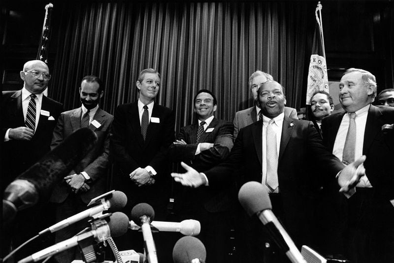 One of Mayor Young's biggest moments was hosting the 1988 Democratic National Convention. The event put the city in the international spotlight, with Young beaming at the center of it. Here, Georgia Democrats, including U.S. Rep John Lewis (front right), announce the location of the convention to the media in 1987. (Louie Favorite / AJC Archive at GSU Library AJCP177-012a)