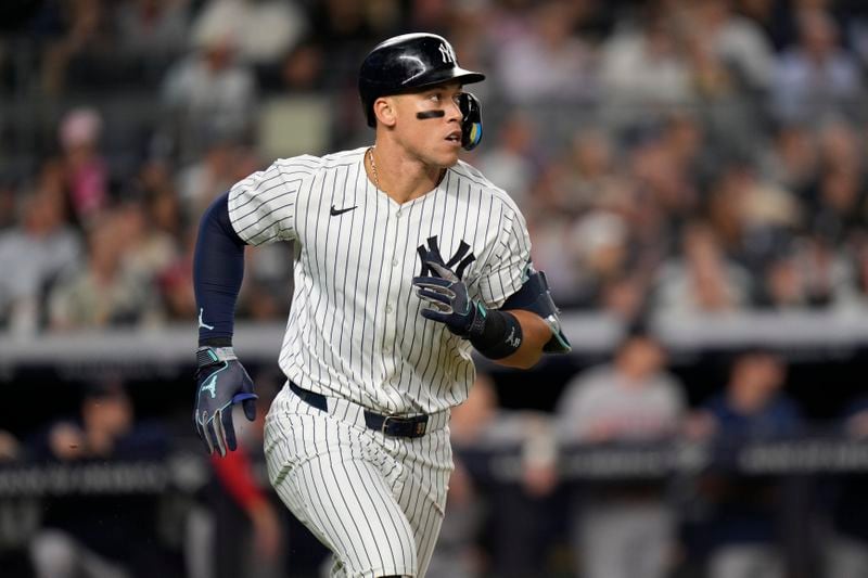 New York Yankees' Aaron Judge runs to first base during the seventh inning of a baseball game against the Boston Red Sox at Yankee Stadium, Thursday, Sept. 12, 2024, in New York. (AP Photo/Seth Wenig)