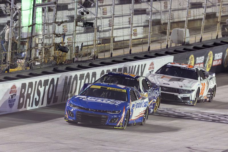 Kyle Larson (5) leads Justin Haley (51) and Todd Gilliland (38) during a NASCAR Cup Series auto race, Saturday, Sept. 21, 2024, in Bristol, Tenn. (AP Photo/Wade Payne)