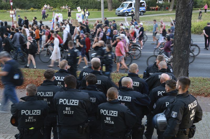 Police officers guard during a anti-fascist rally following the results of the state elections in Erfurt, Germany, Sunday, Sept. 1, 2024. (Michael Reichel/dpa via AP)