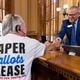 State Election Board Executive Director Mike Coan greets an election skeptic after a hastily planned State Election Board meeting at the Capitol in Atlanta on Friday. (Arvin Temkar / AJC)