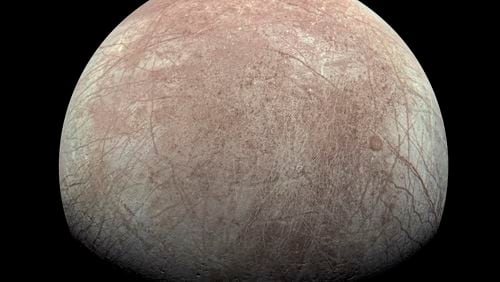 FILE - This image provided by NASA, processed by Kevin M. Gill, shows Jupiter's moon Europa captured by the Juno spacecraft on Sept. 29, 2022, with north to the left. Research published Monday, March 4, 2024, suggests there's less oxygen on the icy surface of Jupiter's moon Europa than thought — and that could affect what if any life might be lurking in the moon's underground ocean. (Kevin M. Gill/NASA/JPL-Caltech/SwRI via AP, File)