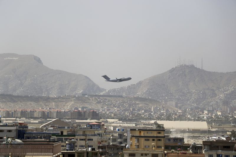 FILE - U.S military aircraft takes off at the Hamid Karzai International Airport in Kabul, Afghanistan, Saturday, Aug. 28, 2021. (AP Photo/Wali Sabawoon, File)