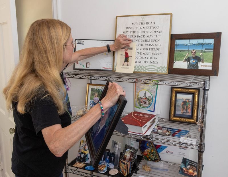 Sharon Winkler looks at photos of her son Alex in her Atlanta home.

PHIL SKINNER FOR THE ATLANTA JOURNAL-CONSTITUTION