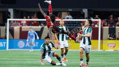 Atlanta United forward Jamal Thiaré, top center left, is fouled by Santos Laguna defender Bruno Agustin Amione (2), bottom center left, during the second half of a Leagues Cup match soccer match on Aug. 4 in Atlanta. (Miguel Martinez/Atlanta Journal-Constitution)