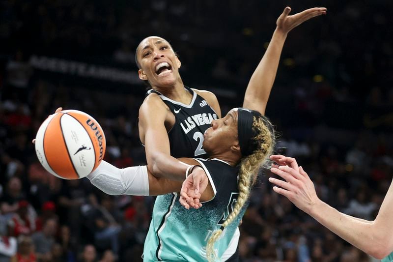 Las Vegas Aces center A'ja Wilson reacts while being fouled by New York Liberty forward Kayla Thornton during the first half of a WNBA Semifinal game, Sunday, Oct. 6, 2024, in Las Vegas. (AP Photo/Ian Maule)