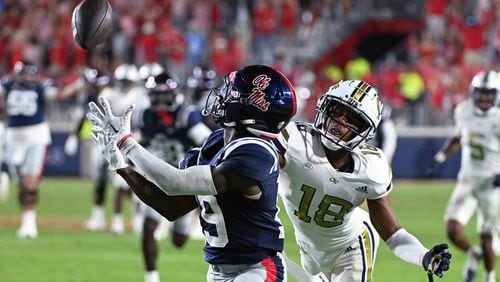 Mississippi wide receiver Dayton Wade (19) catches a pass past Georgia Tech defensive back Ahmari Harvey (18) during the second half an NCAA college football game in Oxford, Miss., Saturday, Sept. 16, 2023. (AP Photo/Thomas Graning)