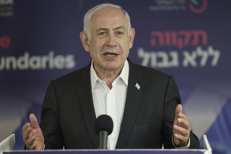 Israeli Prime Minister Benjamin Netanyahu speaks during a news conference at the Sheba Tel HaShomer Hospital in Ramat Gan, Israel on Saturday, June 8, 2024. Israel on Saturday carried out its largest hostage rescue operation since the war with Hamas began, taking four to safety out of central Gaza as heavy fighting continued there. (Jack Guez/Pool Photo via AP)