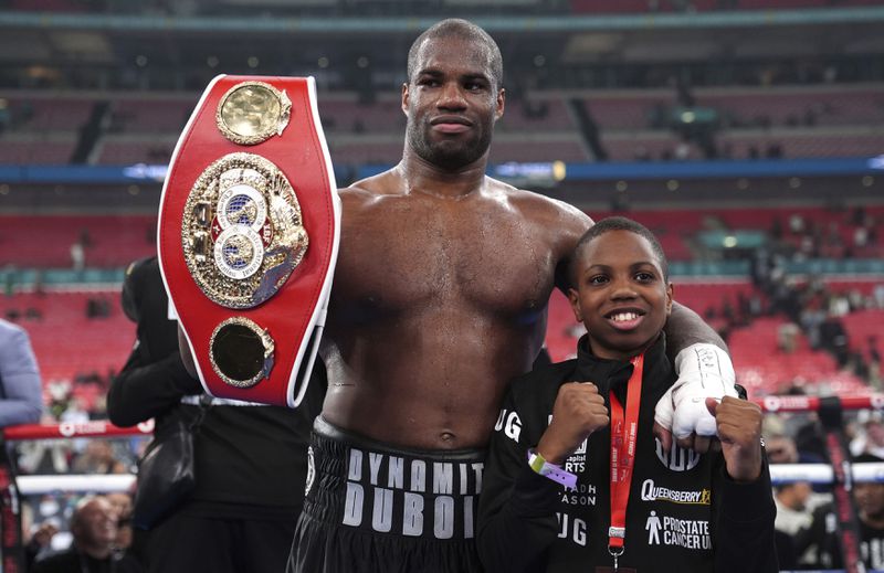 Daniel Dubois celebrates victory against Anthony Joshua, not pictured, in the IBF World Heavyweight bout at Wembley Stadium, in London, Saturday, Sept. 21, 2024. (Bradley Collyer/PA via AP)