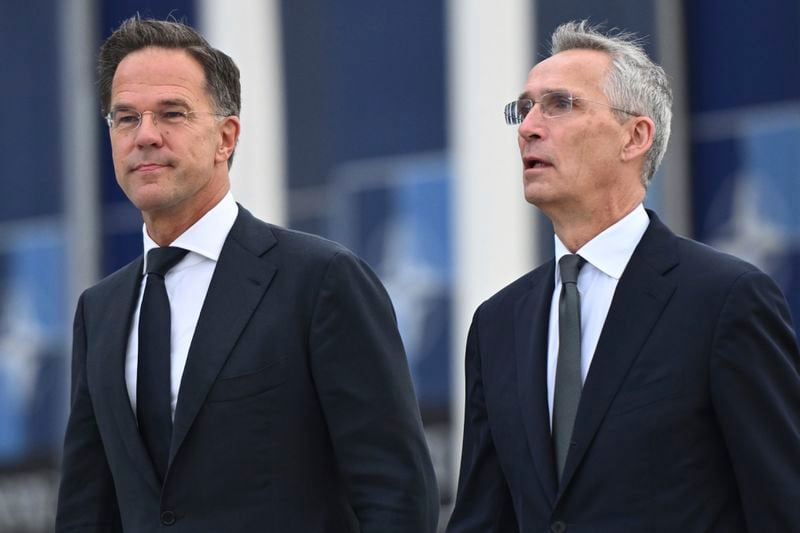 NATO Secretary General Jens Stoltenberg, right, and the incoming NATO Secretary General Mark Rutte arrive for a transition ceremony at NATO headquarters in Brussels, Tuesday, Oct. 1, 2024. (AP Photo/Harry Nakos)