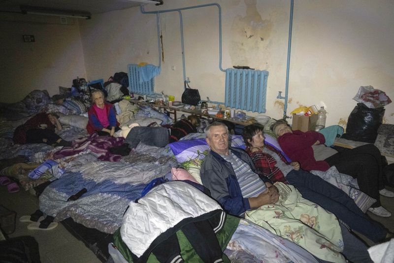 Local residents hide in a basement in Sudzha, Kursk region, Russia, Friday, Aug. 16, 2024. This image was approved by the Ukrainian Defense Ministry before publication. (AP Photo)