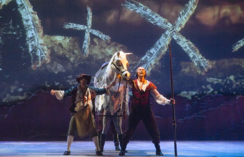 Can you see the horse’s legs? Two Atlanta Ballet dancers in a 2018 performance bring the fabricated horse to life, alongside characters Pancho Sanchez (left) and Don Quixote.