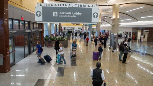 Travelers arrive and depart the international terminal at Hartsfield-Jackson Atlanta Airport Tuesday, May 10, 2022. (Steve Schaefer / steve.schaefer@ajc.com)
