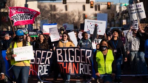 FILE - People march through downtown Amarillo to protest a lawsuit to ban the abortion drug mifepristone, Feb. 11, 2023, in Amarillo, Texas. Two years after the U.S. Supreme Court ended a nationwide right to abortion, travel and pills have become big parts of the issue.(AP Photo/Justin Rex, File)
