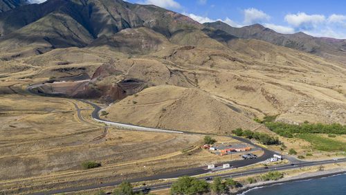 Olowalu temporary landfill site for the debris from the Lahaina fire is seen on Sunday, July 7, 2024, in Lahaina, Hawaii. (AP Photo/Mengshin Lin)