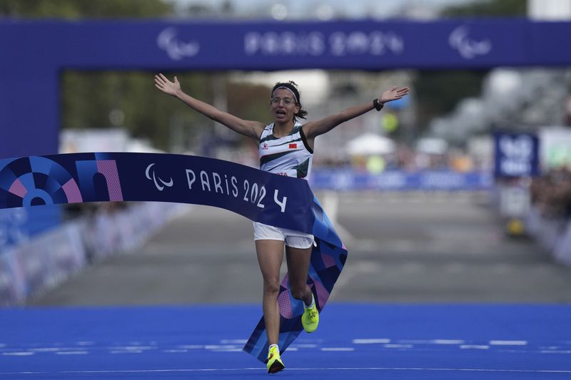 Morocco's Fatima Ezzahra El Idrissi wins the women's marathon T12 at the 2024 Paralympics, Sunday, Sept. 8, 2024, in Paris, France. (AP Photo/Thibault Camus)