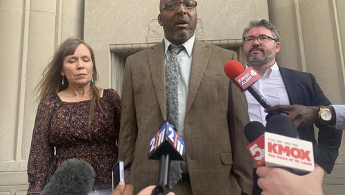 Christopher Dunn stands free after his murder conviction was overturned after 34 years behind bars, on the steps of a courthouse in downtown St. Louis, Tuesday, July 30, 2024. (Laurie Skrivan/St. Louis Post-Dispatch via AP)