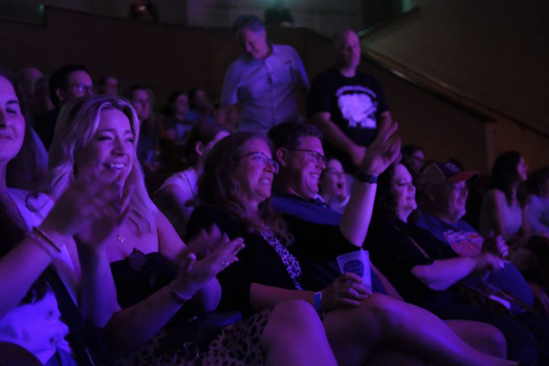 The audience reacts during a performance at the Ryman Auditorium in Nashville, Tenn., on July 30, 2024. (AP Photo/Luis Andres Henao)