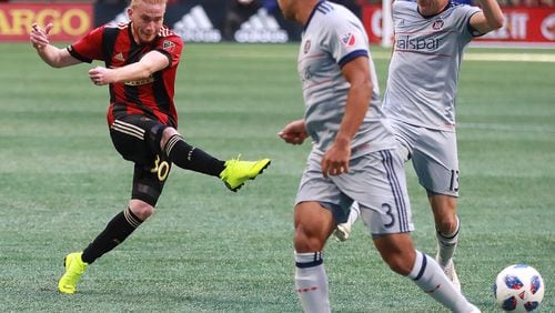 October 21, 2018 Atlanta: Atlanta United midfielder Andrew Carleton gets off a shot on goal between Chicago Fire defenders Brandon Vincent and Brandt Bronico during the second half in a MLS soccer match on Sunday, Oct 21, 2018, in Atlanta.   Curtis Compton/ccompton@ajc.com