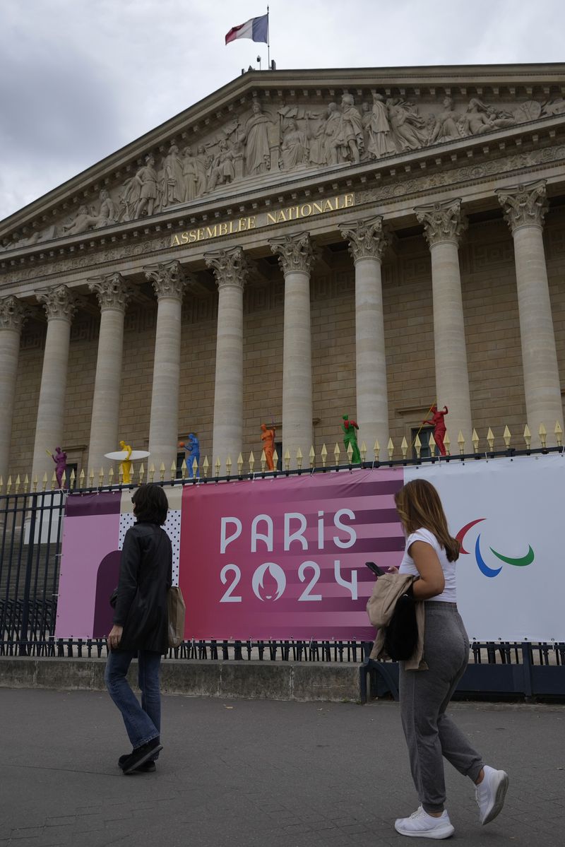 Copies of one of the most famous Greek statues, the Venus of Milo, are installed on the steps of the French National Assembly Wednesday, July 3, 2024 in Paris. Just three weeks before the Olympics, the excitement that was building up in the host city has mingled with anxiety about France’s political future. (AP Photo/Thibault Camus)
